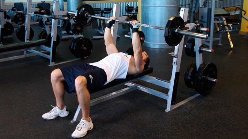 To dry out the shoulders and chest, perform a barbell bench press on a level bench. 